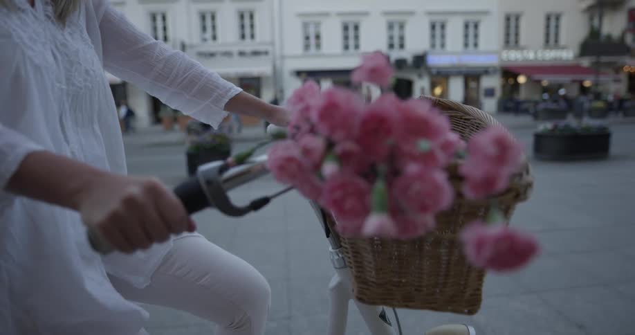 Woman Riding Bike To Coffee Shop