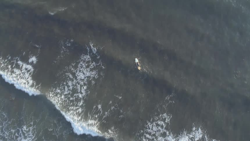 Ocean waves break and splash