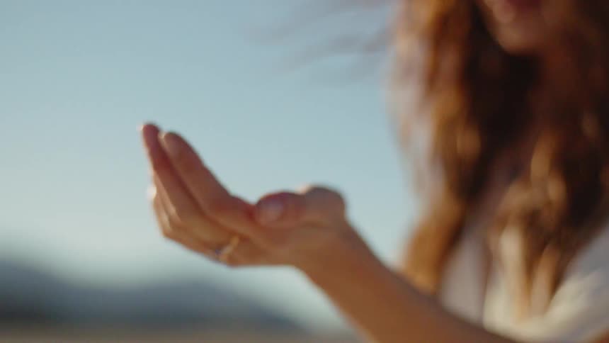 A woman wearing a ring outdoors