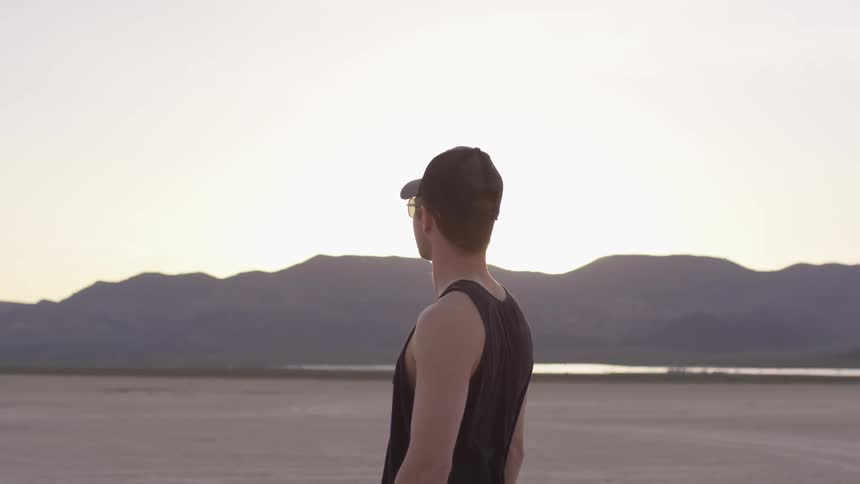 A man stares at the mountains