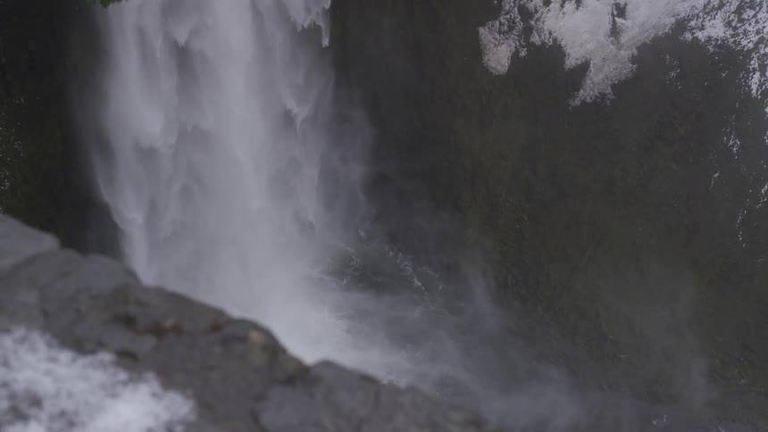 Mist is spraying up from a waterfall