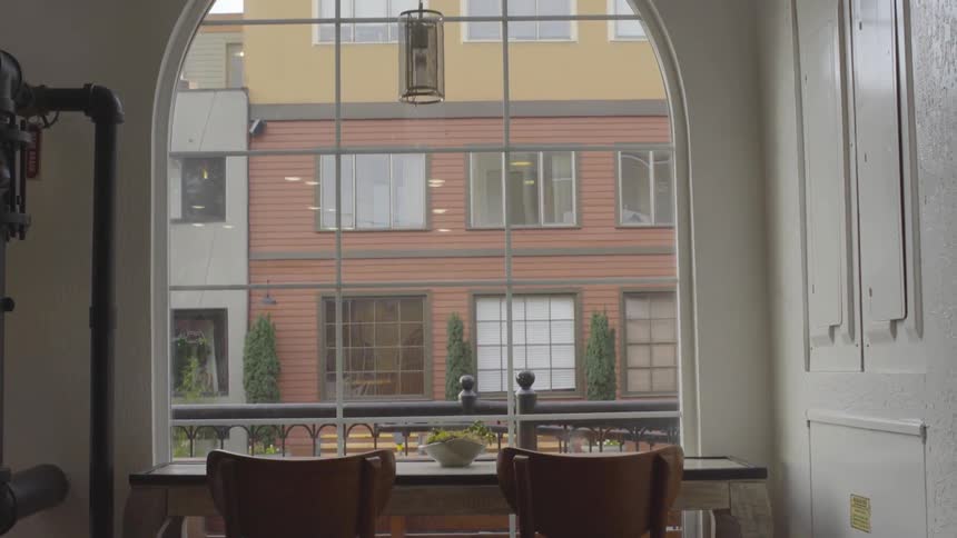 Table and two chairs in front of a window