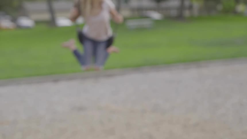 A child swings at a playground