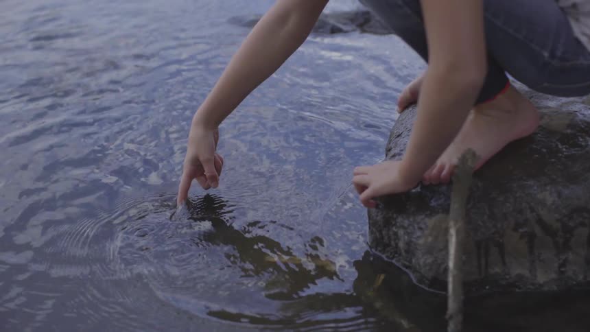 A child playing with water