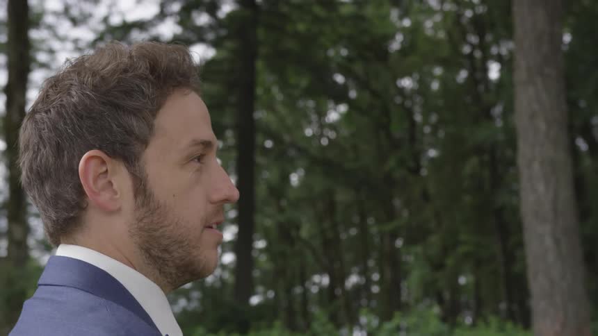 A man looking into a forest