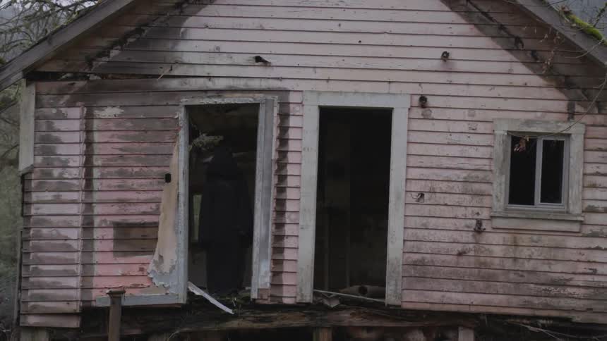 Hooded Figure In Abandoned House
