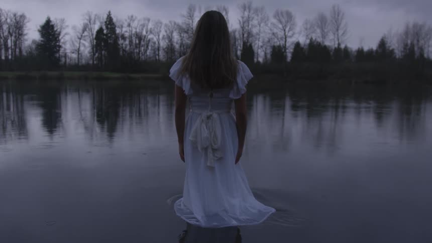 Girl Wading In Pond