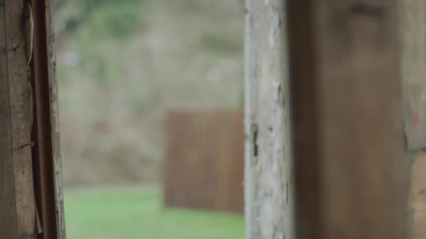 Hooded Figure In Abandoned House