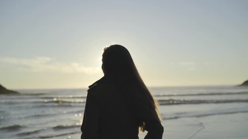 A woman looking out to the ocean
