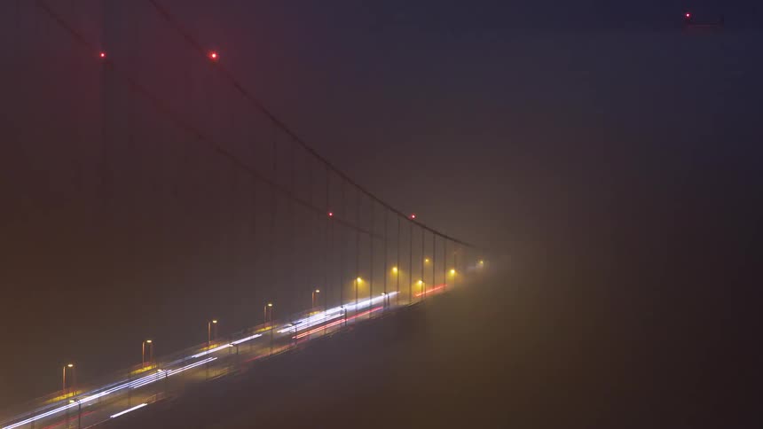 Cars are driving on the bridge