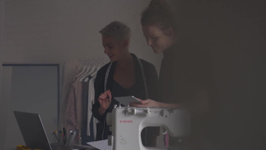 Two women looking at something on a tablet