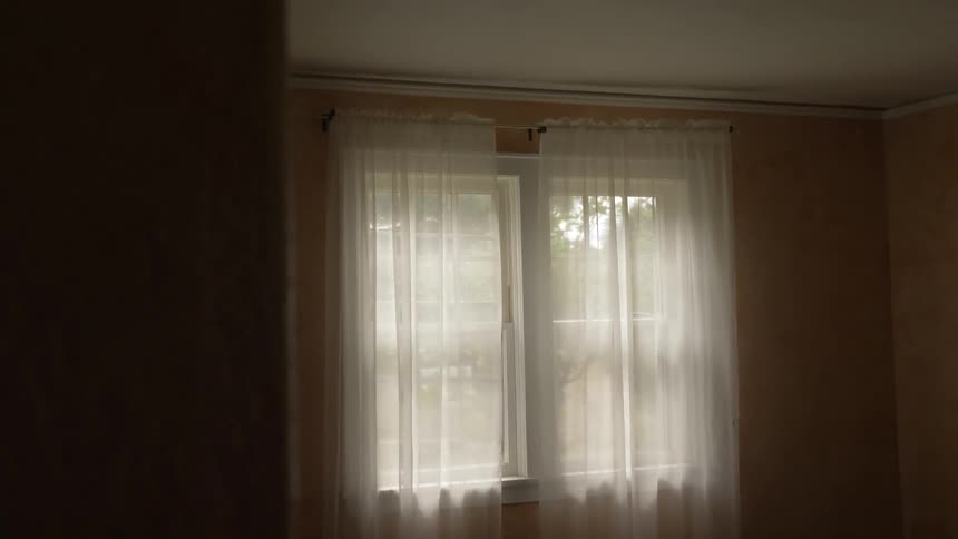A window with sheer blinds on it
