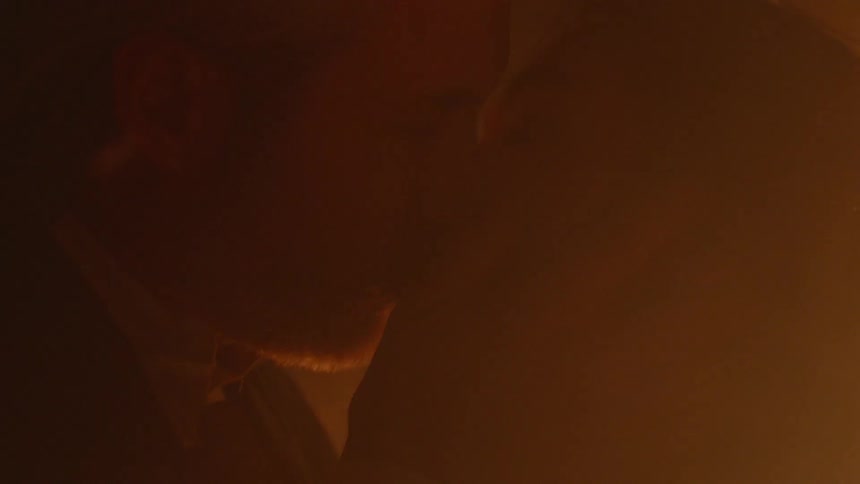 A man and woman are kissing
