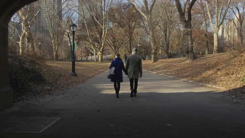 A man and woman holding each other outside