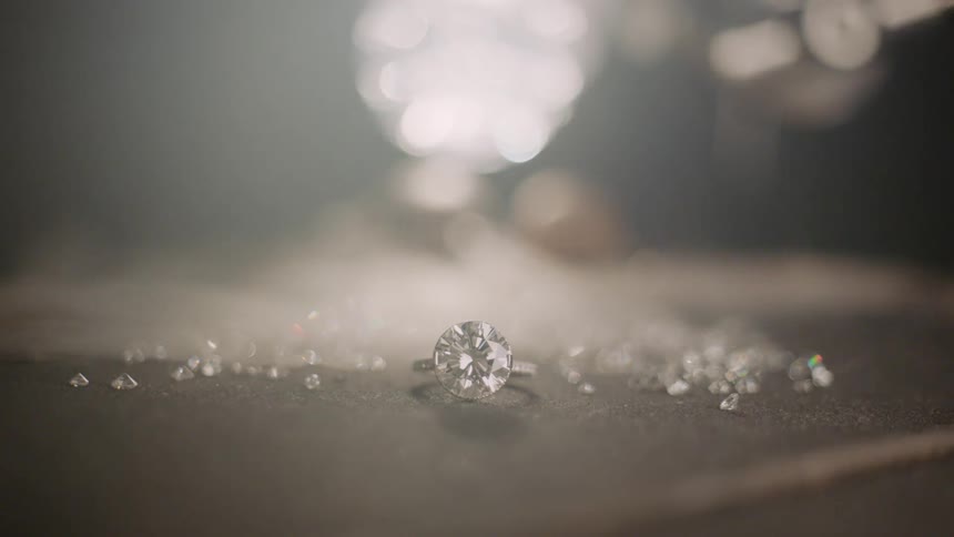 A large diamond ring with fog rolling over it