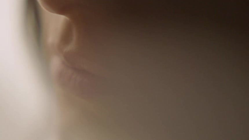 Light shines on a woman's face