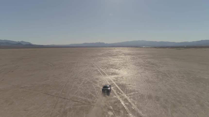 A car is driving in a remote area