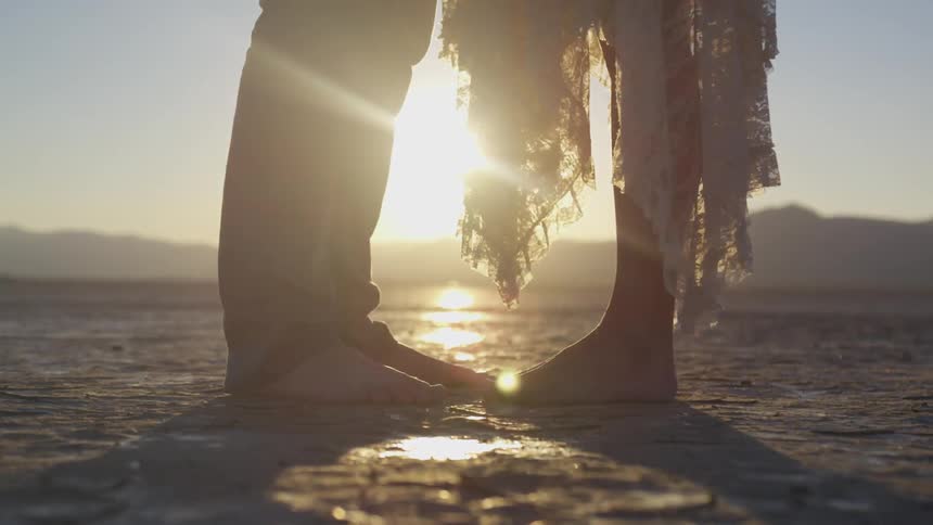 Couple Dancing In The Desert