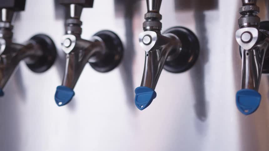 Beer taps in a bright room