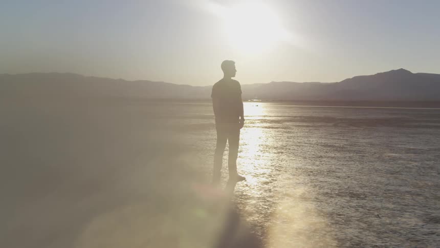 Man standing on a dry desert