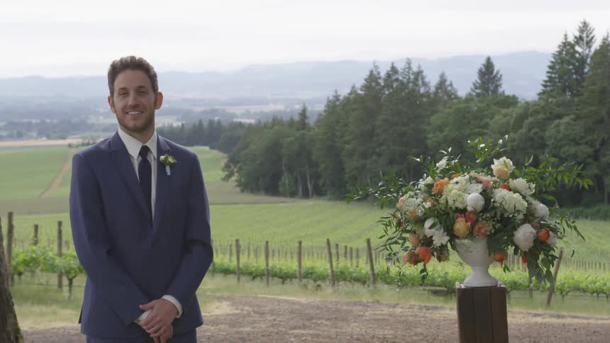 Groom waits at the altar outside under the sun