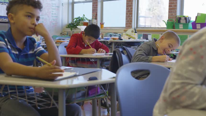 Young children sitting at their school desks