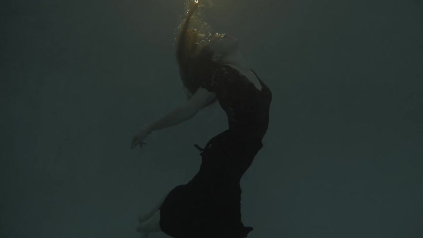 A woman swimming underwater
