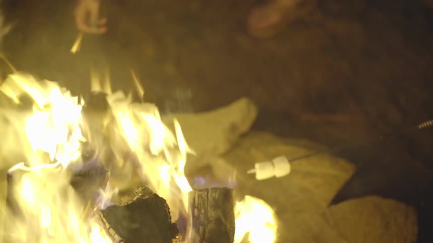 Marshmallows being roasted over a fire