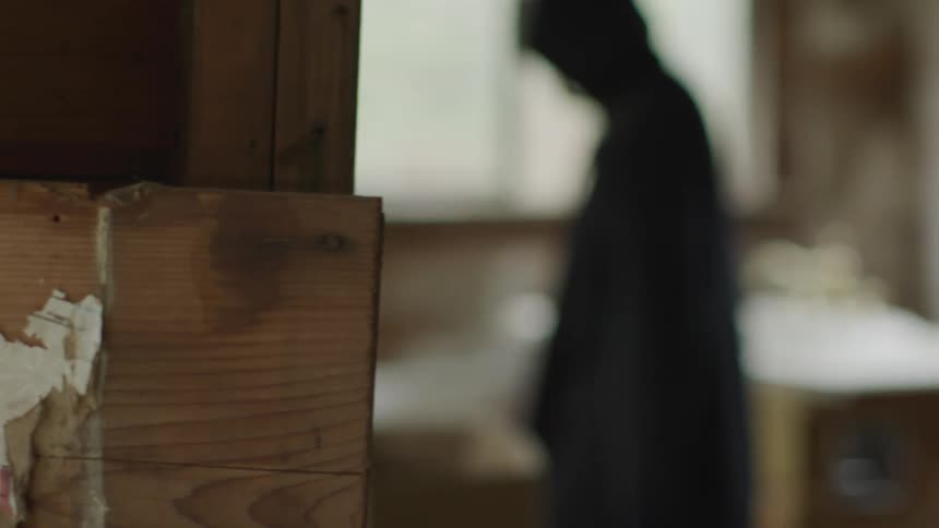 Hooded Figure In Abandoned House