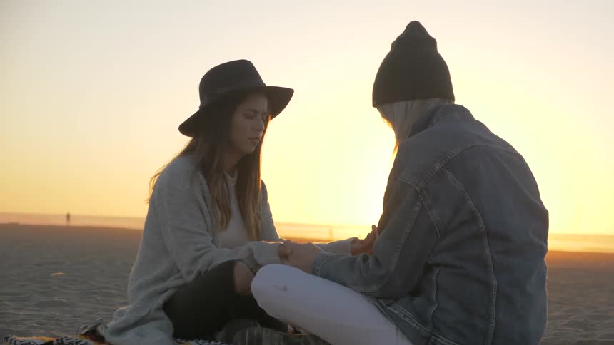 Friends Praying On The Beach