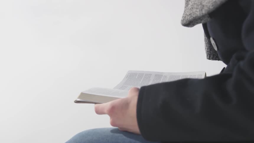 Person opens bible