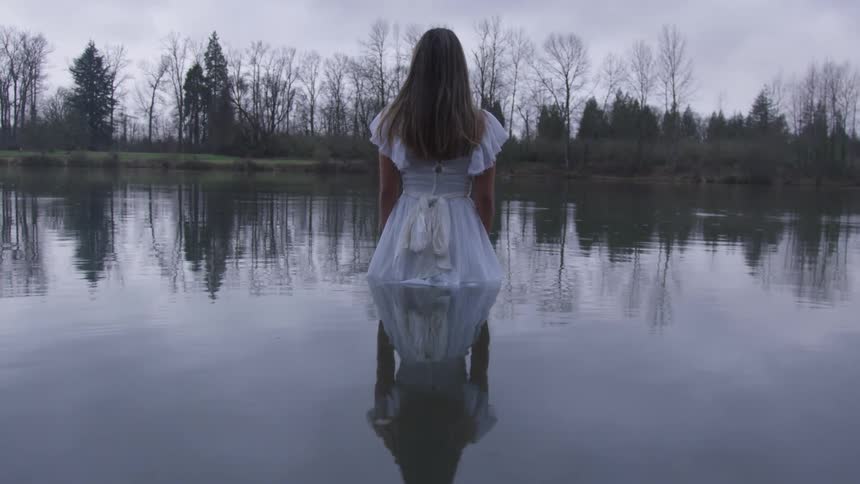 Girl Wading In Pond