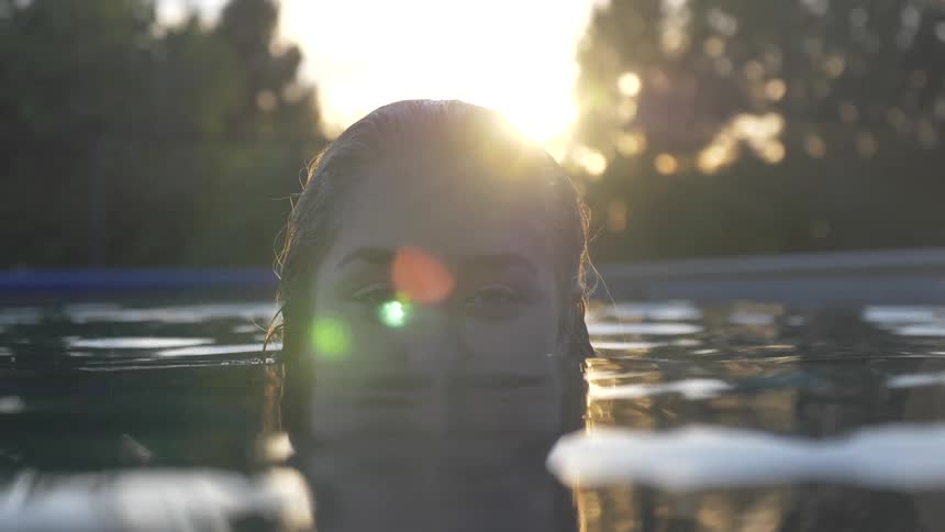 Woman submerged up to her nose in water