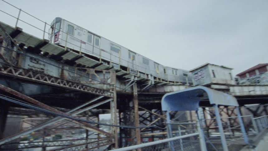 A train moving along its elevated tracks