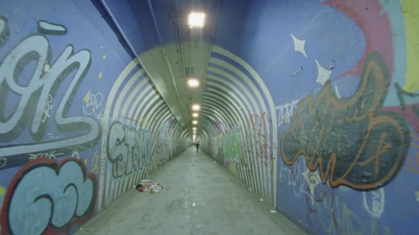 Long graffiti lined tunnel