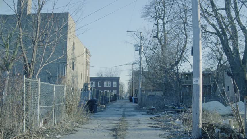 An empty street between buildings