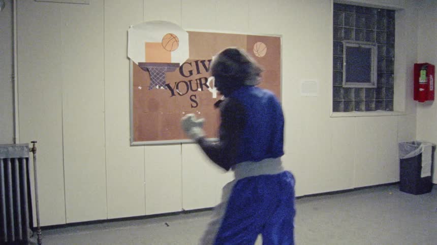 A boxer punches the air