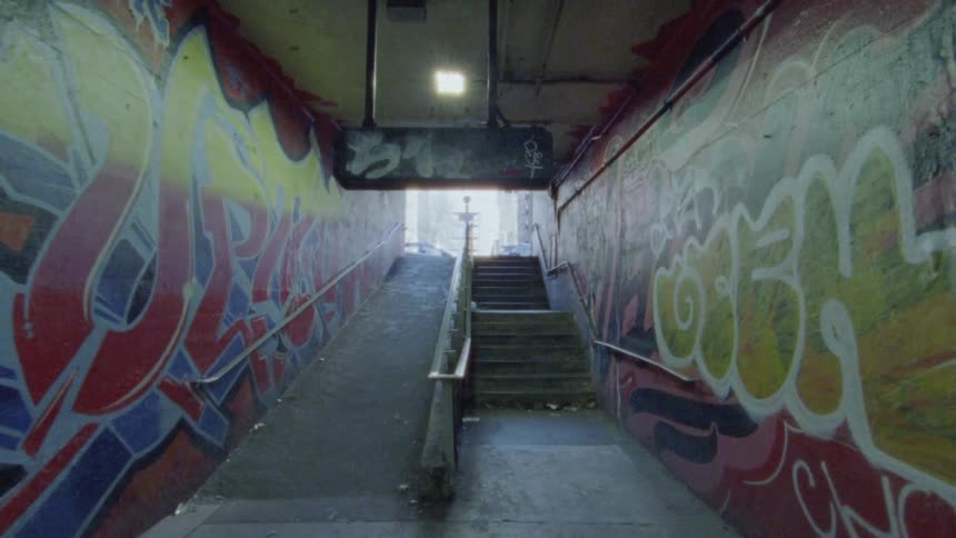 Underground pedestrian passage filled with graffiti
