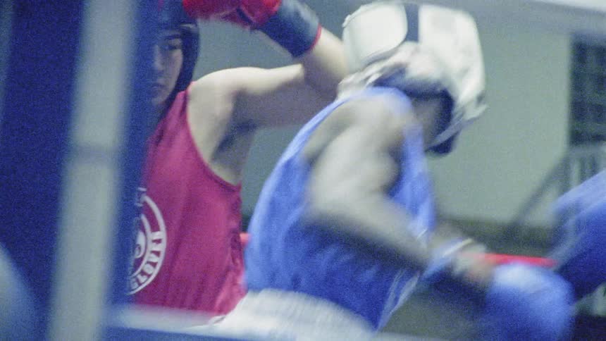 Two men box in ring