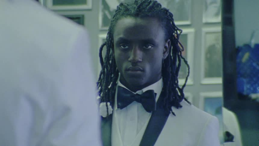 A man looking at himself in a mirror