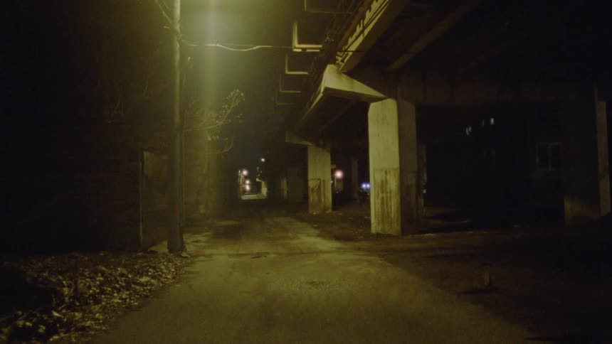 Under the train platform at night there are few lights