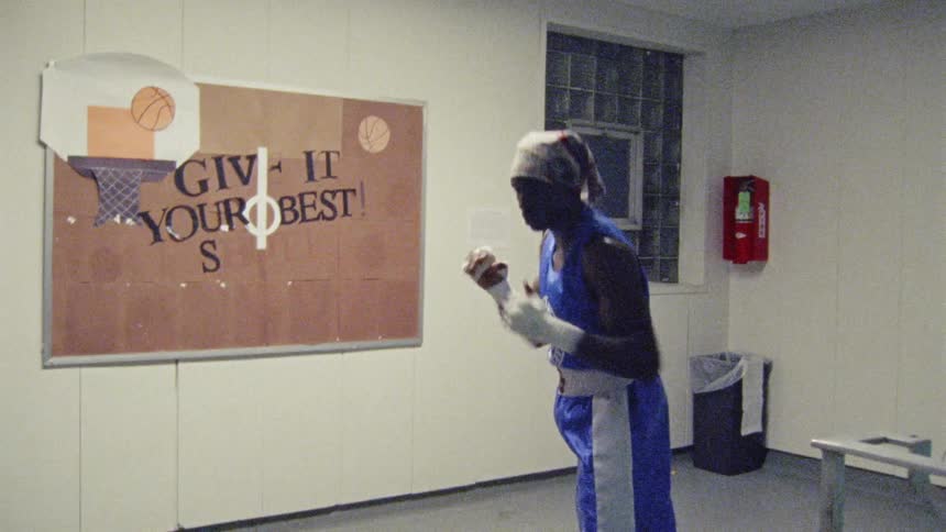 Man practices boxing on a gym