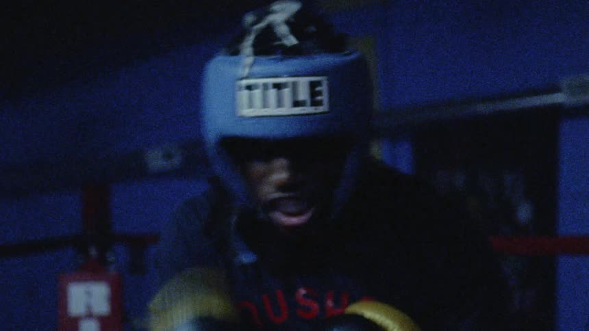 A boxer throws punches in the ring