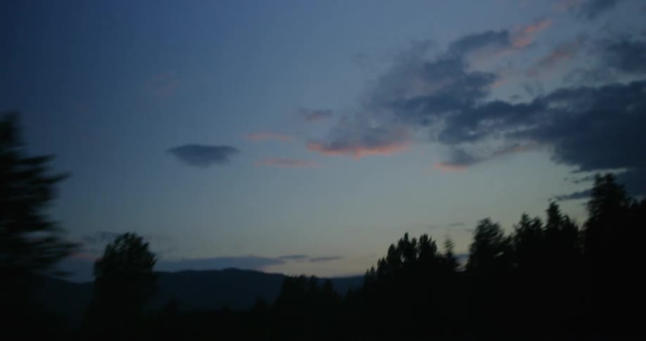 The clouds spread over a forest at sunset