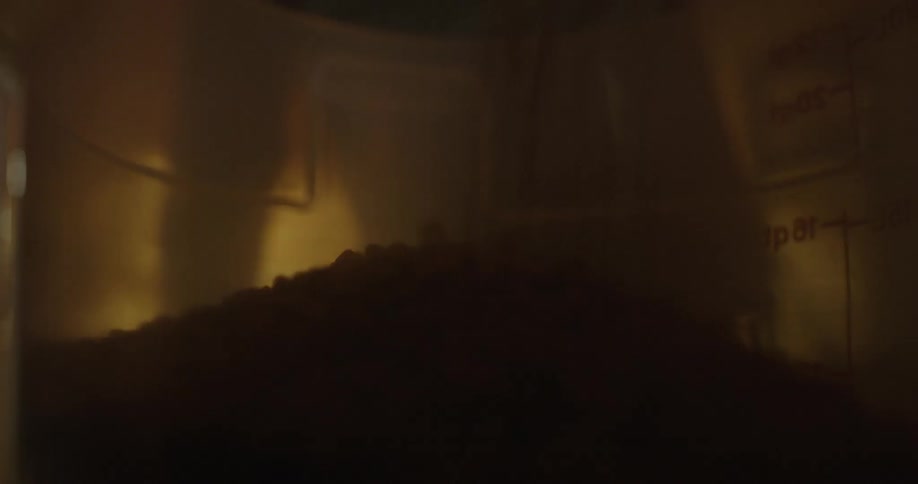 A large amount of a small object being poured into a large container