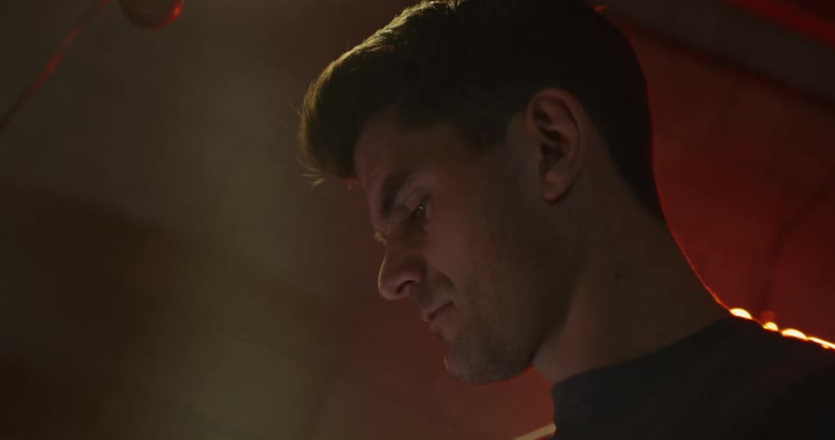 A man is looking around indoors