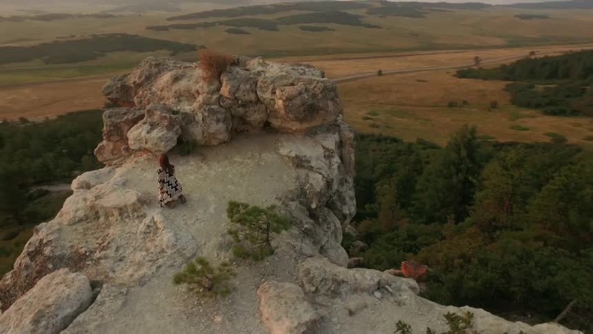 A person walking on a cliff edge