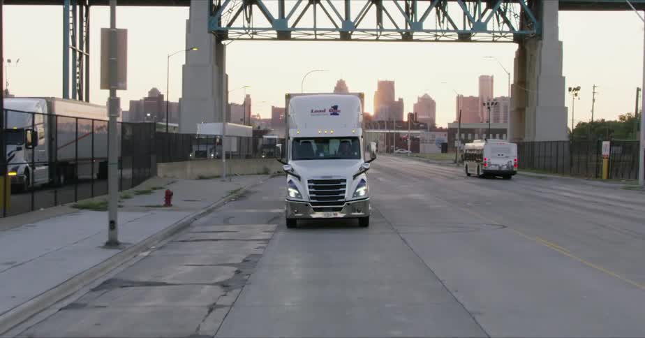 A truck driving down a road