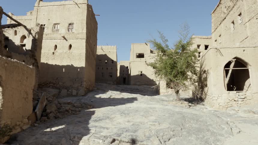 The sun casts a glow on old mediterranean buildings