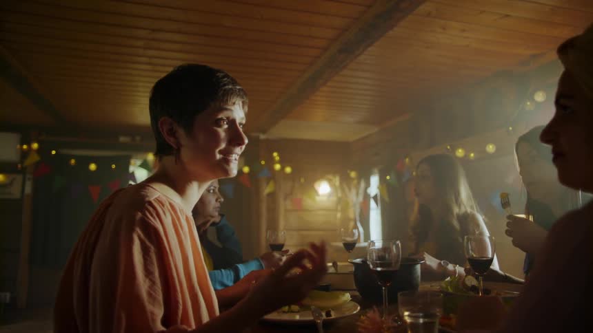 People talk, eat and drink at a party